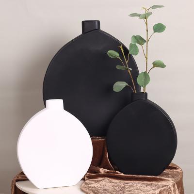 China Modern Simple Flat Style Classic Black And White Ceramic Vase Drum Bottle Home Jewelry Ornaments Soft Model Room Decoration for sale