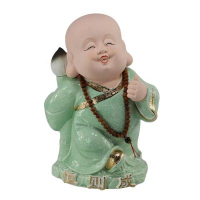 China Religious Baby Buddha Statues from China Mini Crafts Handmade Ceramic for sale