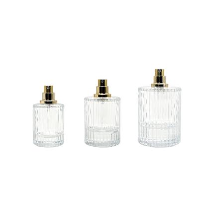 China Cosmetic Custom Made Luxury Fragrance Striped Empty 30ml 50ml 100ml Round Cylinder Glass Spray Atomizer Perfume Bottles for sale