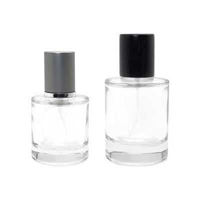 China Cosmetic Wholesale Manufacturer Luxury Empty Round Cylinder Spray Perfume Glass Bottle 30ml 50ml for sale