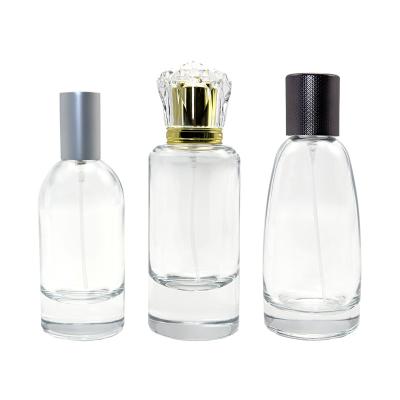 China Cosmetic Wholesale Manufacturer Custom Made Luxury Empty Round Cylinder Spray Perfume Glass Bottle 50ml 55ml 100ml for sale