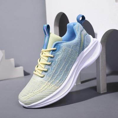 China Fashion Trend 2023 spring flying weaving women's shoes fashion casual shoes women light outdoor running sports shoes for sale