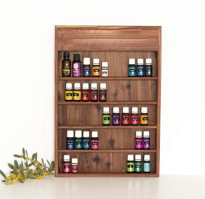 China Global Personalized Engraved Wooden Essential Oil Storage Shelf Wall Shelf for sale