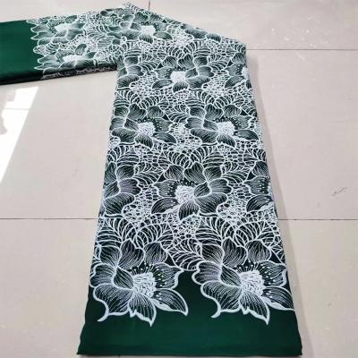 China Breathable Laser Cut Hollow Embroidered Fabric Floral Chiffon For Women Dresses for sale