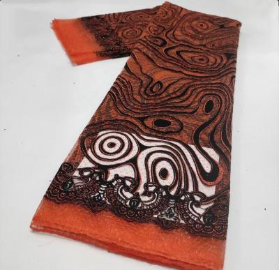 China Newest Sustainable Design African Orange Organza Lace Fabric Garment DIY Accessory for sale