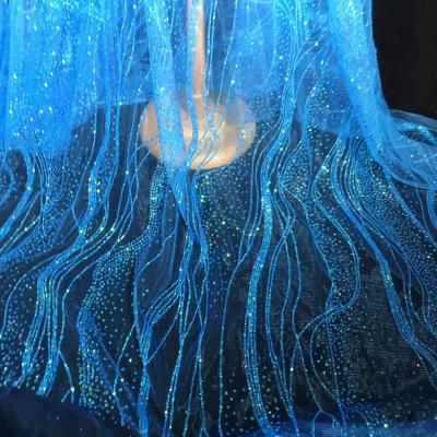 China Sustainable Elegant Blue Glitter Mesh Sparkle Net Lace Fabric For Wedding for sale