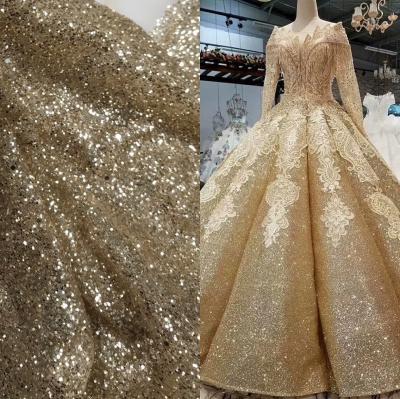 China Viable Wholesale Gold Sparkle Glitter Fabric Lace For Evening Dress for sale