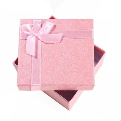 China Recycled Pink Glossy Materials Price Voucher Lamination Gift Cardboard Small Small Craft Prize Box With Ribbon for sale