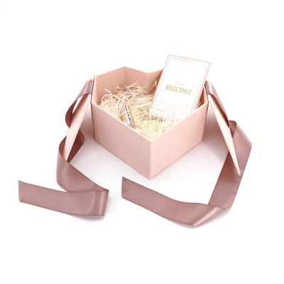 China Recycled Glossy Cosmetic Hot Pink Heart Shape Materials New Products Lamination Packaging Cardboard Box With Ribbon for sale