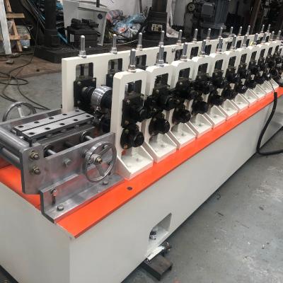 China High Speed 30m/Min Stainless Steel Glass Sliding Door Channel Roll Forming Machine With Servo Following Cutting for sale