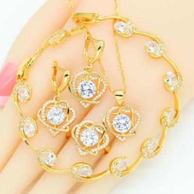 China Romantic Heart Gold Color Jewelry Sets For Women Bracelet White Stone Necklace Pendant Earrings Ring Gift for sale