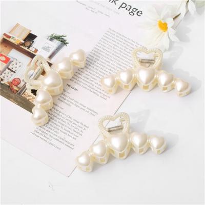 China Factory direct sales pearl hair accessories white plastic ladies crochet big delicate heart word shark clip wholesale for sale