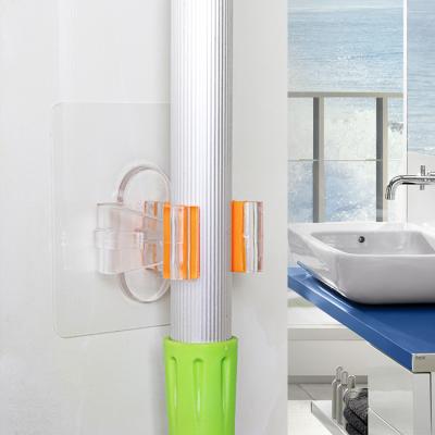 China Durable Flexible Adhesive Wall Mount StorageSelf Garden Tool Organizer Broom Mop Holder Broom Cleaning Clip for sale