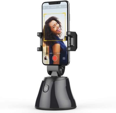 China 360 Degree Rotating Automatic Smart Shooting Selfie Stick Follow Automatic AI-Dialing Object Tracking Gimbal Face Tracking Camera Phone Holder for sale