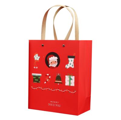 China Recyclable Eco-frendly Custom Christmas Pattern Hard Paper Gift Bag for sale