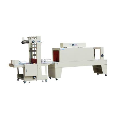 China Semi Automatic Pet Water Bottle PE Food Glass Film Carton Plastic Sleeve Shrink Paper Wrapping Machine for sale