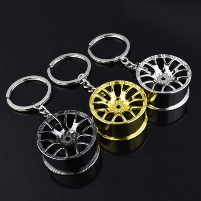 China Creative New Fashion Design Fresh Luxury Metal Car Key Chain Wheel Hub Key Chain Key Chain For Man Women Gift for sale