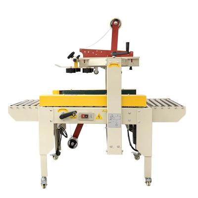 China FXC4030 Semi Automatic Food Box Machine Carton Sealer Tapping Machine for sale