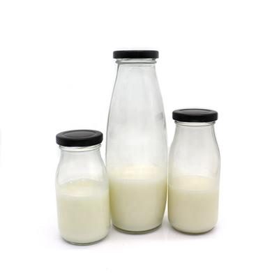 China 1L Recyclable Beverage Bottles Glass Milk Storage Packaging Vintage Milk Bottles With Metal Screw Lid for sale