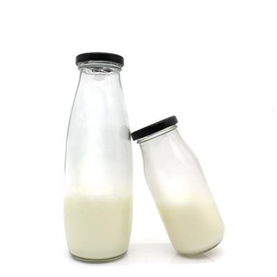 China Wholesale Recyclable Round Milk Bottle Juice Beverage Glass Bottles Large Glass Milk Bottle for sale