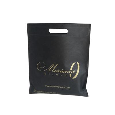 China Eco-Friendly Wholesale Custom Gold Printing Die Cut Handles Non Woven Fabric Bag For Clothes Store Portable Cloth Shopping Bags for sale