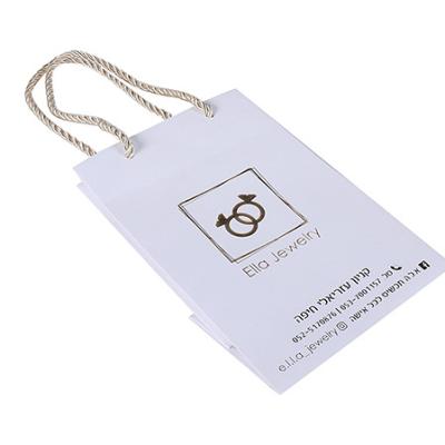 China New Design Handmade Stock Trapezoidal Shape Hot Foil Logo Paper Bags for sale