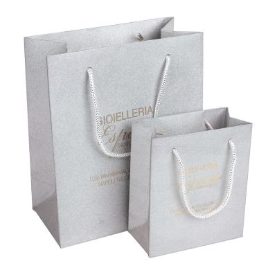 China Disposable gray special paper bag with logo paper bag barbie fashionistas clothes gold hot stamping package for sale