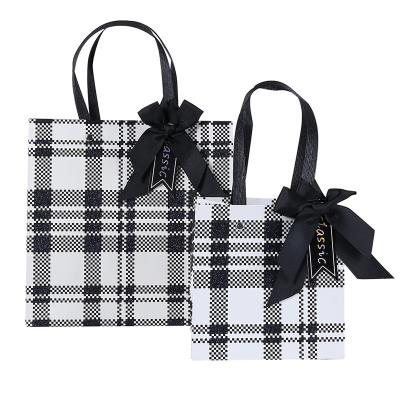 China Recyclable Luxury Custom Logo Printed Dark Gray Paper Shopping Bags with Ribbon Bow Shoes and Dressing Paper Bags for sale