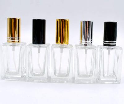 China Personal Care Square Base Transparent Glass Liquid Bottle Dispensing Cosmetic Glass Bottle for sale