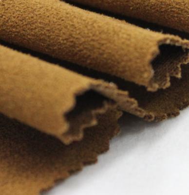 China Hot New Design 2022 Shrink-Resistant Fabric Hot Popular Polyester Knitted Artificial Suede Fabric Leather Fabric For Cloth for sale