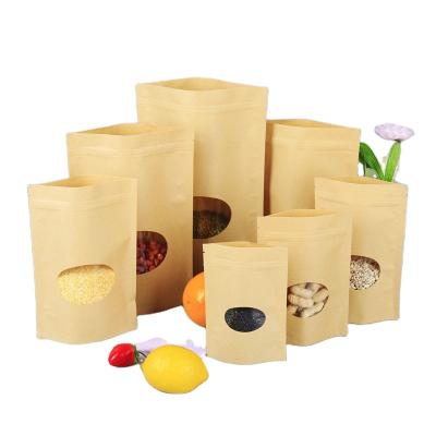 China Recycled Materials Customized Heat Sealed Kraft Paper Pouch Coffee Bean Dried Fruits Packaging Zipper Bag With Window for sale