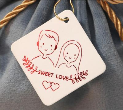 China Recycled materials gold stamping custom printing hang tags die cuttng small tags with safety pin to wedding candy box baking packaging for sale