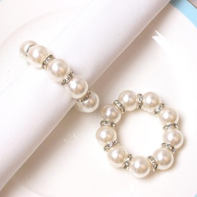 China Imitation Stone Stocked Napkin Rings Pearl Beaded Napkin Holder For Dinner Table Decoration Party And Wedding for sale