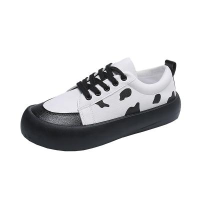 China New Fashion Cow Ladies Flat Shoes Cushioning Sports Casual Sneakers for sale