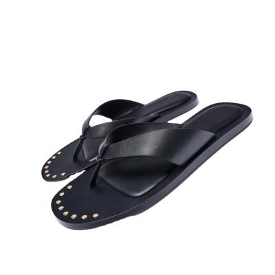 China New Design Flat Women's Shoes Flip Flops Wear Personality Fashion Thick Bottom Rivet Clip Black Leather Sandals for sale