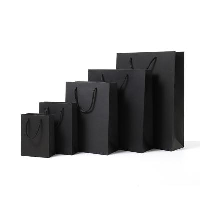 China Recyclable Manufacturers Plain Custom Logo Black Eco Friendly Kraft Paper Gift Wrapping Shopping Paper Bag For Clothing for sale