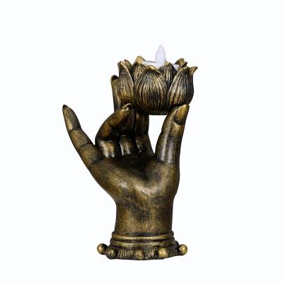 China Wholesale Resin Lotus Buddha Candle Holder Religious Hand Buddha Statue From Europe for sale