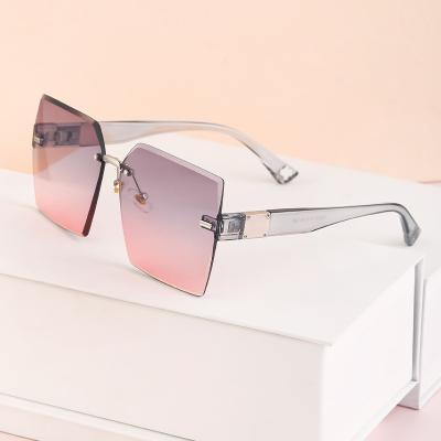 China Hombres 2022 cheap de personalizado de logotipo de montura de sin de cuadradas d'espejo tenido de plastico UV400 gafas de sol de nuevo rimless for sale