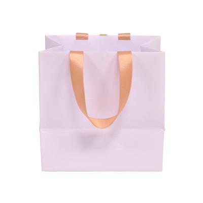 China Custom Logo Automatic Flour Packing Machine Recyclable Handle White Kraft Cardboard Bag Packing Gift Paper Bags for sale