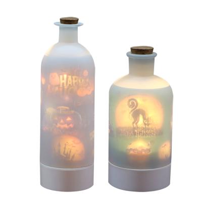 China 2022 Newest Design Glass+PP Rotating Bottle Projector Lights Home Decor Bottle Projector Lights For Halloween for sale