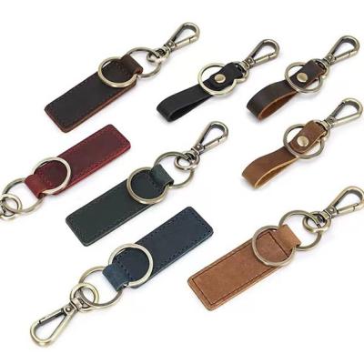 China Top Layer Cowhide Car Vintage Genuine Leather Key Chain Pendant Logo Cut Out Wrist Strap High-grade Luxury Brown Men's Bayonet Gift for sale