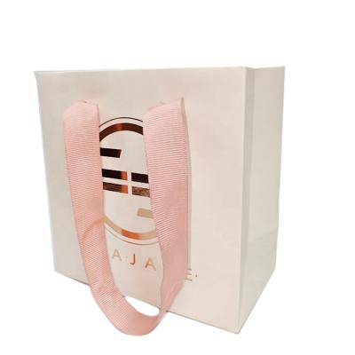 China Recyclable Custom Logo Printed Reusable Paper Bag Recyclable Shopping Package for sale