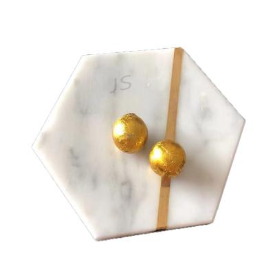 China Sustainable Wine Tea Coffee Drinks Polished Golden Marble Stone Sandstone Coasters With Feet for sale