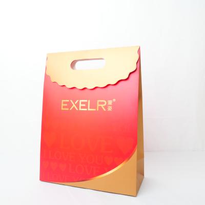 China Euro Ribbon Handle Boutique Shopping Recyclable Luxury Packaging Customized Printed Kraft Paper Gift Bags With Logo for sale