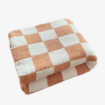 China Nordic wind soft waxy jacquard checkerboard knitted velvet sofa cover simple thin air conditioning cover blanket for sale