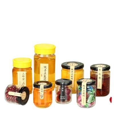 China Wholesale Food Safety 25ml 50ml 80ml 100ml 150ml 195ml 240ml 350ml 500ml Food Storage Honey Jars Round Storage Glass Jar With Metal Lid for sale