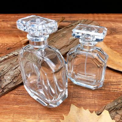 China Factory price 50ml 100ml fashionable cheap clear spray pump empty glass perfume bottle with glass cap for sale