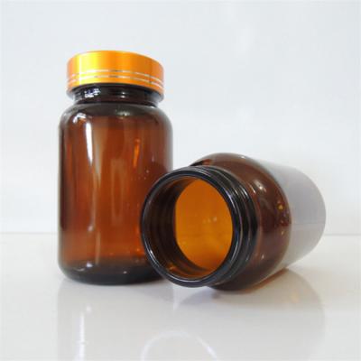 China Medicine Amber Empty 150ml Medical Glass Capsule Bottle With Gold Silver Screw Cap for sale