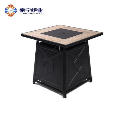 China Unique iron stocked and ceramic table fire pit for the backyard for sale