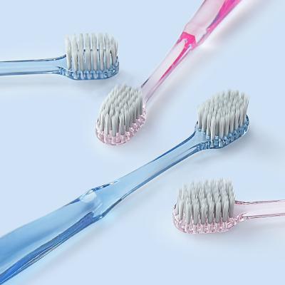 China For Home Use Manufacturers Wholesale Ag+ Wide Head Crystal Handle Adult Soft Transparent Plastic Toothbrush With Package for sale